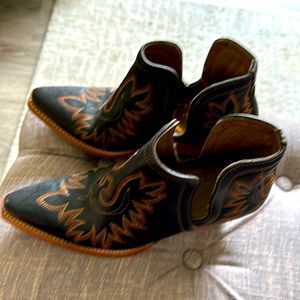 Cowboy Ariat ankle boots.